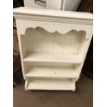 White painted hanging shelving unit