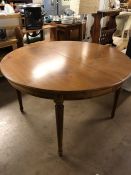 Circular extending table with fluted legs