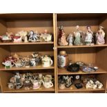 Large collection of ceramics and figurines over six shelves