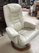 Cream leather swivel chair on wooden base