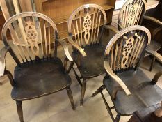 Set of four wheel-back carver chairs