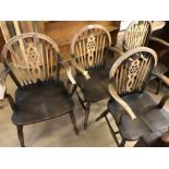 Set of four wheel-back carver chairs