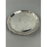 Small Silver Salver Measuring 5.5mm in diameter, Pie crust edge on 3 small scroll feet. Birmingham