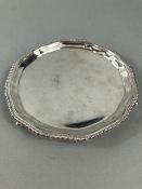 Small Silver Salver Measuring 5.5mm in diameter, Pie crust edge on 3 small scroll feet. Birmingham