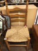 Two rush seated chairs and a oak side table