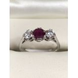 Ruby and Diamond 3 stone ring in 18ct White Gold. Central Ruby measures approx: 5.06mm in diameter