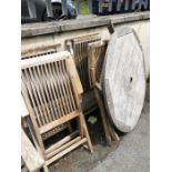 Circular wooden garden table and four chairs