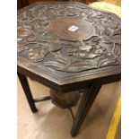 Carved occasional table in the Arts & Crafts style