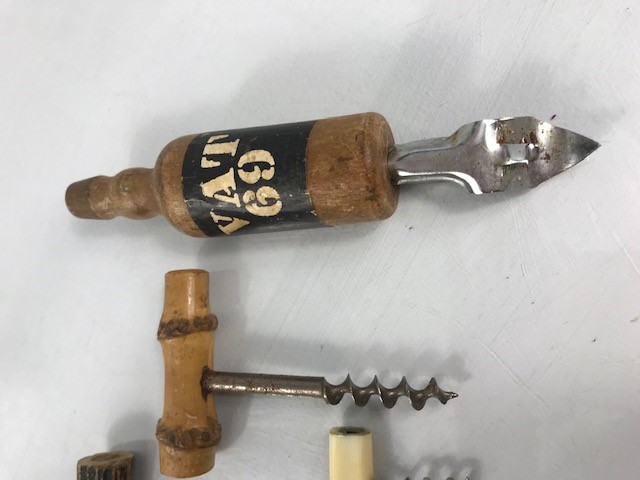 VAT 69 bottle opener and three old corkscrews - Image 2 of 3