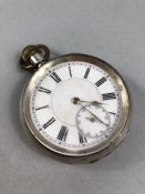 Silver Pocket watch with White face and Roman numerals marked 935 (winds and runs)