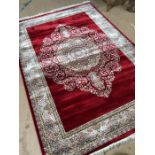Red ground woven silk floral medallion pattern rug approx. 240cm x 160cm
