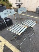 Pair of metal folding garden chairs with pierced backs