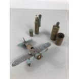 Two WWI trench art lighters and a trench art model plane