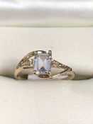 9K Gold Ring, Emerald cut CZ and 2 very small Diamond chips. Size approx: ‘N½‘ UK ‘6½‘ USA. Weight