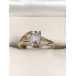 9K Gold Ring, Emerald cut CZ and 2 very small Diamond chips. Size approx: ‘N½‘ UK ‘6½‘ USA. Weight