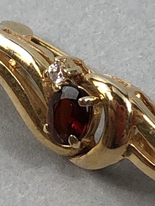 9ct Gold marked 375 Brooch set with central faceted Garnet and a single Diamond - Image 2 of 6