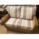 Two-seater conservatory sofa with newly re-covered cushions