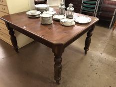 Period table with turned legs on castors.