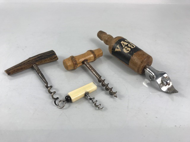 VAT 69 bottle opener and three old corkscrews