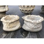 Two small sack shaped garden planters