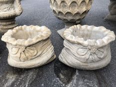 Two small sack shaped garden planters