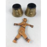 Pair of WW1 trench art brass inkwells and a trench art model of a German soldier with moving arms
