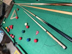 Snooker table on legs with selection of cues approx. 189cm x 97cm with full set balls etc