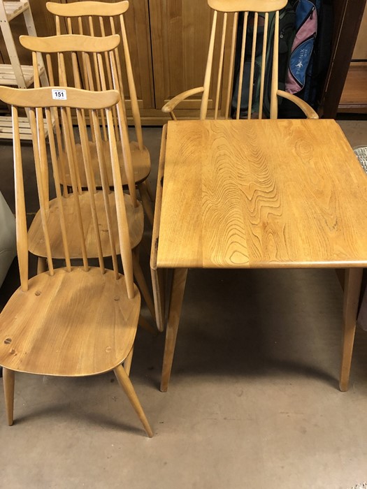 Ercol: Ercol Dining table and four blonde stick back mid century style chairs (one carver)