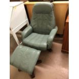 Green leather swivel/recliner chair with footstool