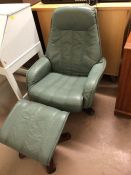 Green leather swivel/recliner chair with footstool