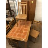 Tile-topped kitchen/dining table with four chairs