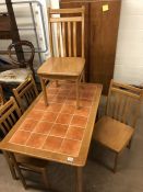 Tile-topped kitchen/dining table with four chairs