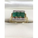 14ct Gold Emerald and Diamond Contemporary style Ring. The 3 centre Emeralds across the centre