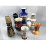 Collection of nine posy vases to include West German lava vase