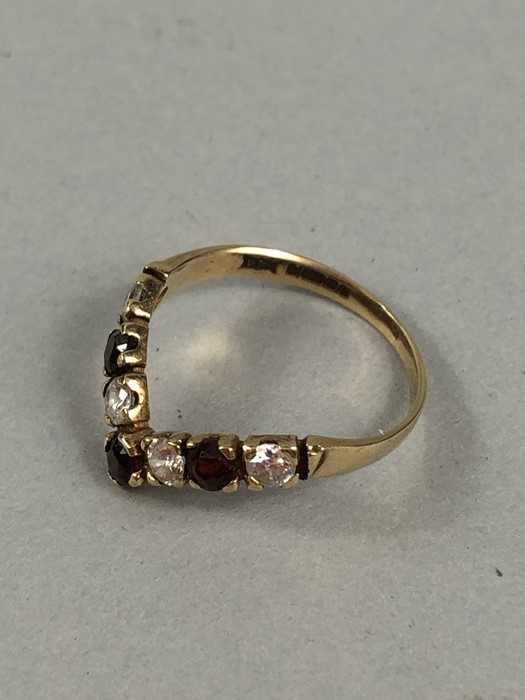 9ct Gold Wishbone Ring, Set with 4 (CZ) stones and 3 Red (Garnet) stones. Size approx: ‘O’ UK, ‘7’ - Image 5 of 5