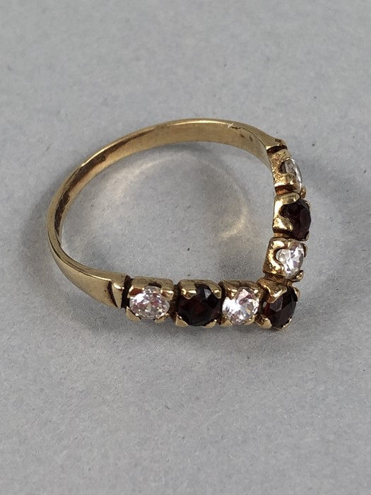 9ct Gold Wishbone Ring, Set with 4 (CZ) stones and 3 Red (Garnet) stones. Size approx: ‘O’ UK, ‘7’ - Image 4 of 5