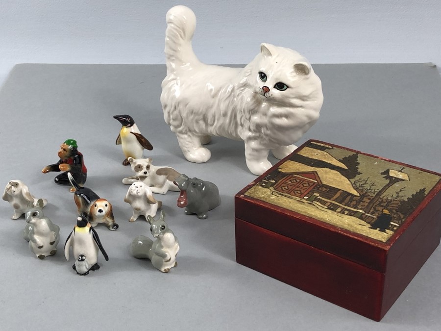 A collection of mostly Russian miniature pottery animals in Russian hand painted box with a