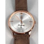 Large faced Rose gold coloured Watch by calvin Klein with brown suede strap