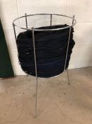 Chrome stand containing large number of folding mesh baskets ideal for shop