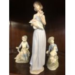 Three porcelain figurines one by Nao