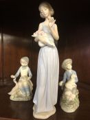 Three porcelain figurines one by Nao