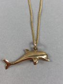 9ct Gold chain with unmarked Gold dolphin pendant total weight 5.4g