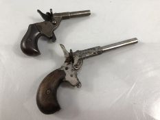 Two muff pistols or pocket pistols the smaller marked RGM and the larger marked Futum