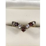 9ct Gold Wishbone Ring, Set with 4 (CZ) stones and 3 Red (Garnet) stones. Size approx: ‘O’ UK, ‘7’