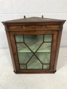 Small glazed corner unit, interior painted green, with key