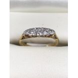 18ct Gold ring set with five Diamonds in a platinum illusion setting total weight approx 2.7g size