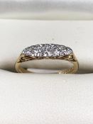 18ct Gold ring set with five Diamonds in a platinum illusion setting total weight approx 2.7g size