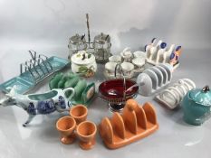 Collection of breakfast ware to include preserve pots, toast racks and egg cups