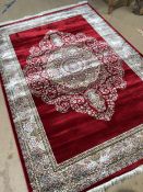 Red ground woven silk floral medallion pattern rug approx. 240cm x 160cm