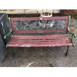 Wrought iron bench with wooden slats